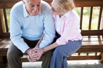 Woman discussing funeral pre-planning options with her husband ...